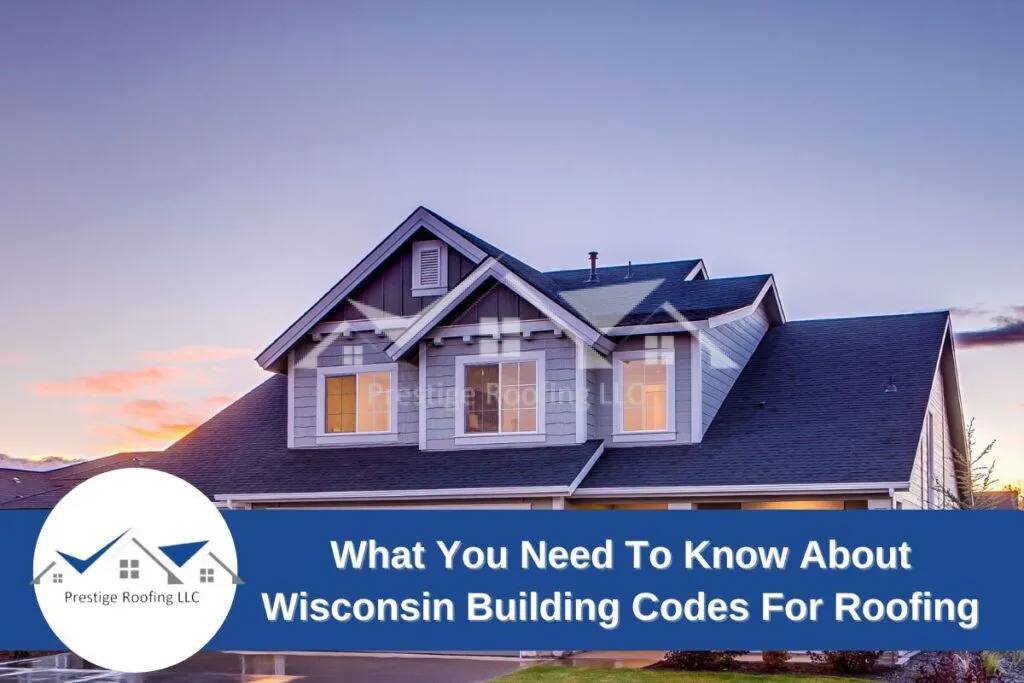 Modern house with dark roof and illuminated windows at sunset - Wisconsin roofing